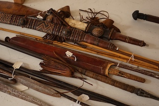 A quantity of African tribal spears swords and tools. Condition - varies